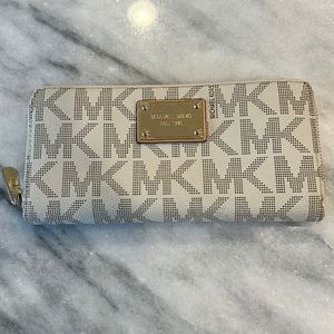 Michael Kors vanilla zip wallet.